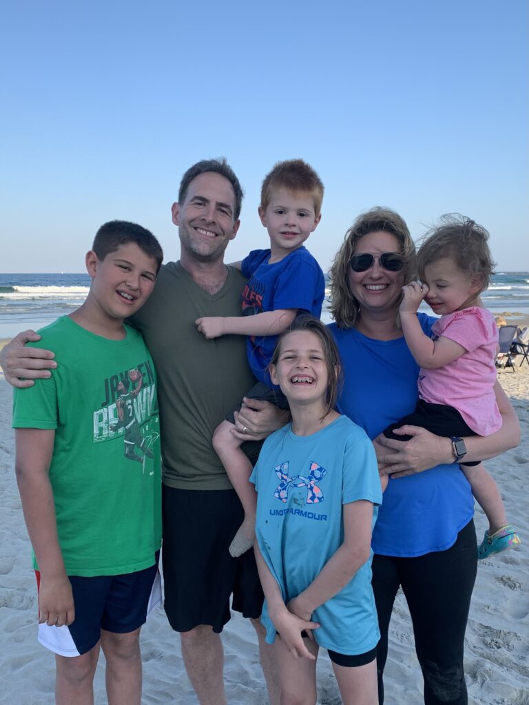VICTORIA ROZZI with his family, a husband and four children